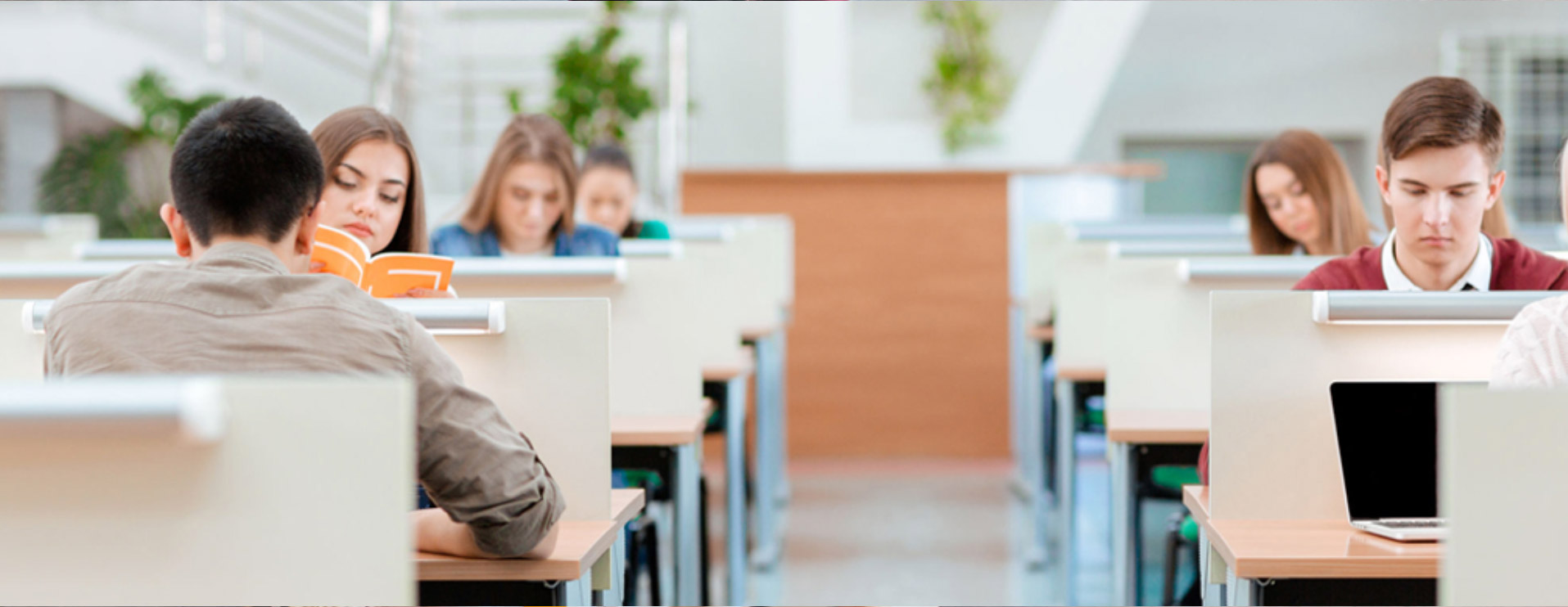 group of graduees throwing hats in the air